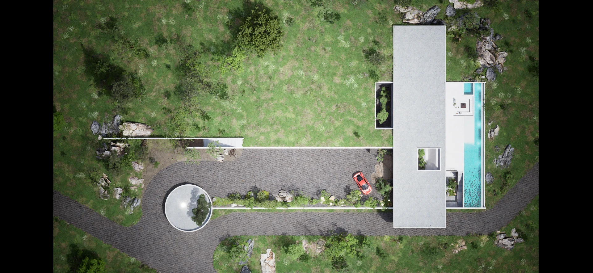 Overhead view of the Bonsai residence, long swimming pool, landscaped grounds and circular driveway