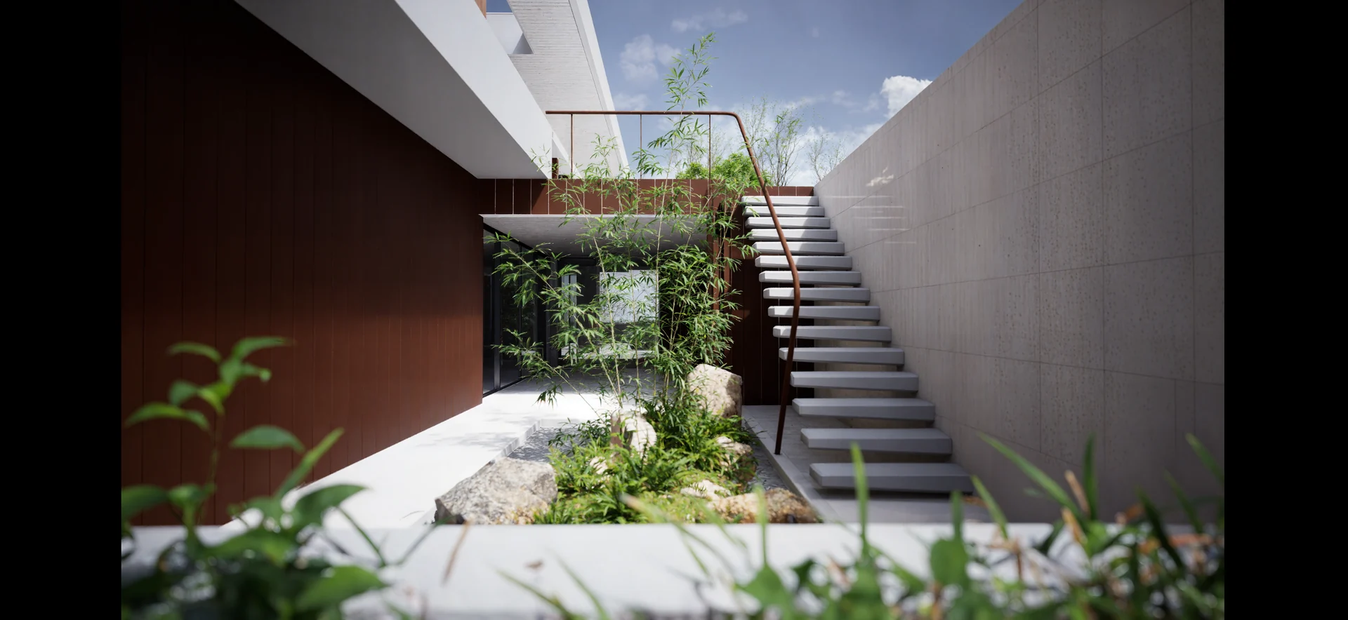 Open-air courtyard with a planted rock garden and stairs beside a pale concrete wall