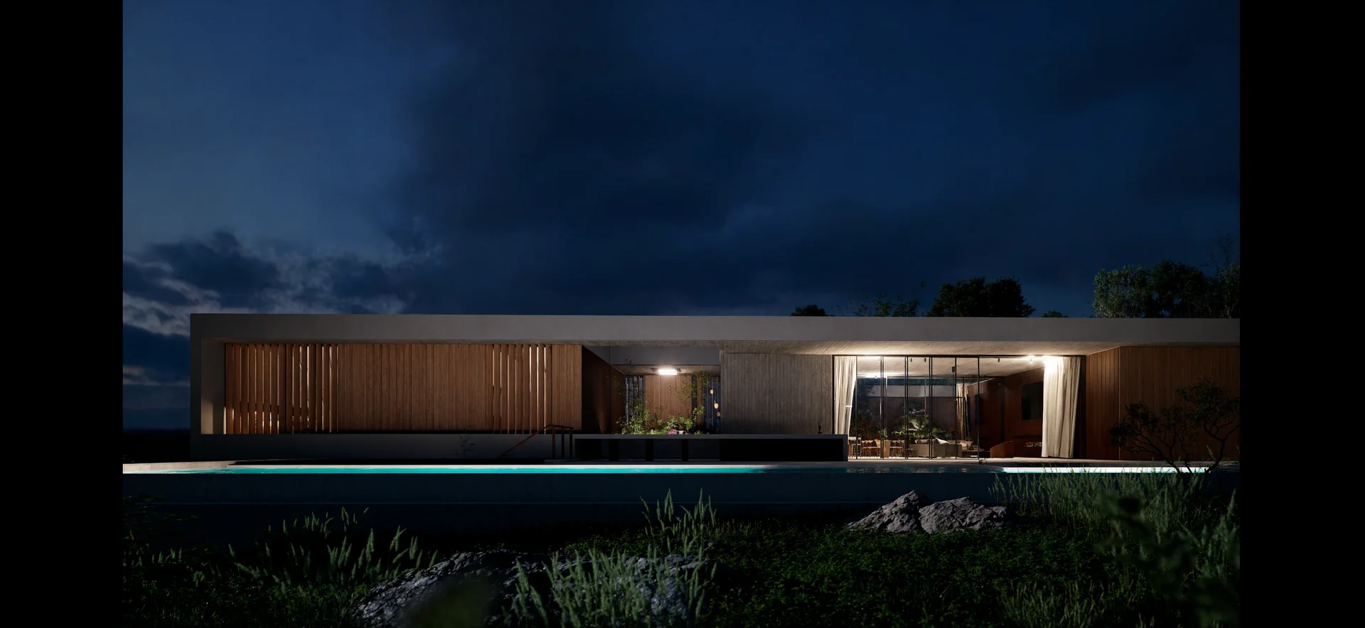 Bonsai garden elevation at night with warmly lit rooms and a softly illuminated swimming pool